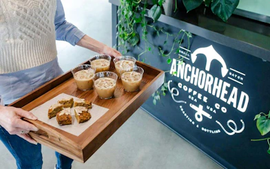 Serving tray with iced coffee and pastries at Anchorhead Coffee Co. during VIP Morning Market Experience.
