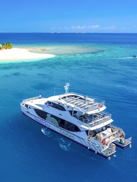 Cruise ship near tropical island in Fiji, South Sea Cruise experience.