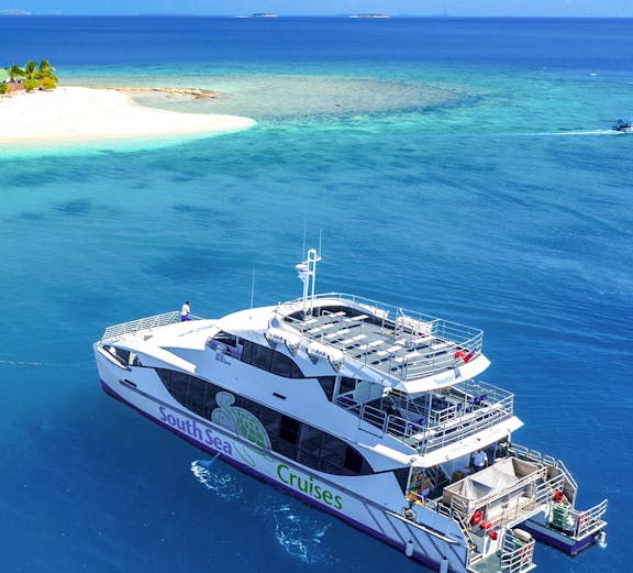 Cruise ship near tropical island in Fiji, South Sea Cruise experience.