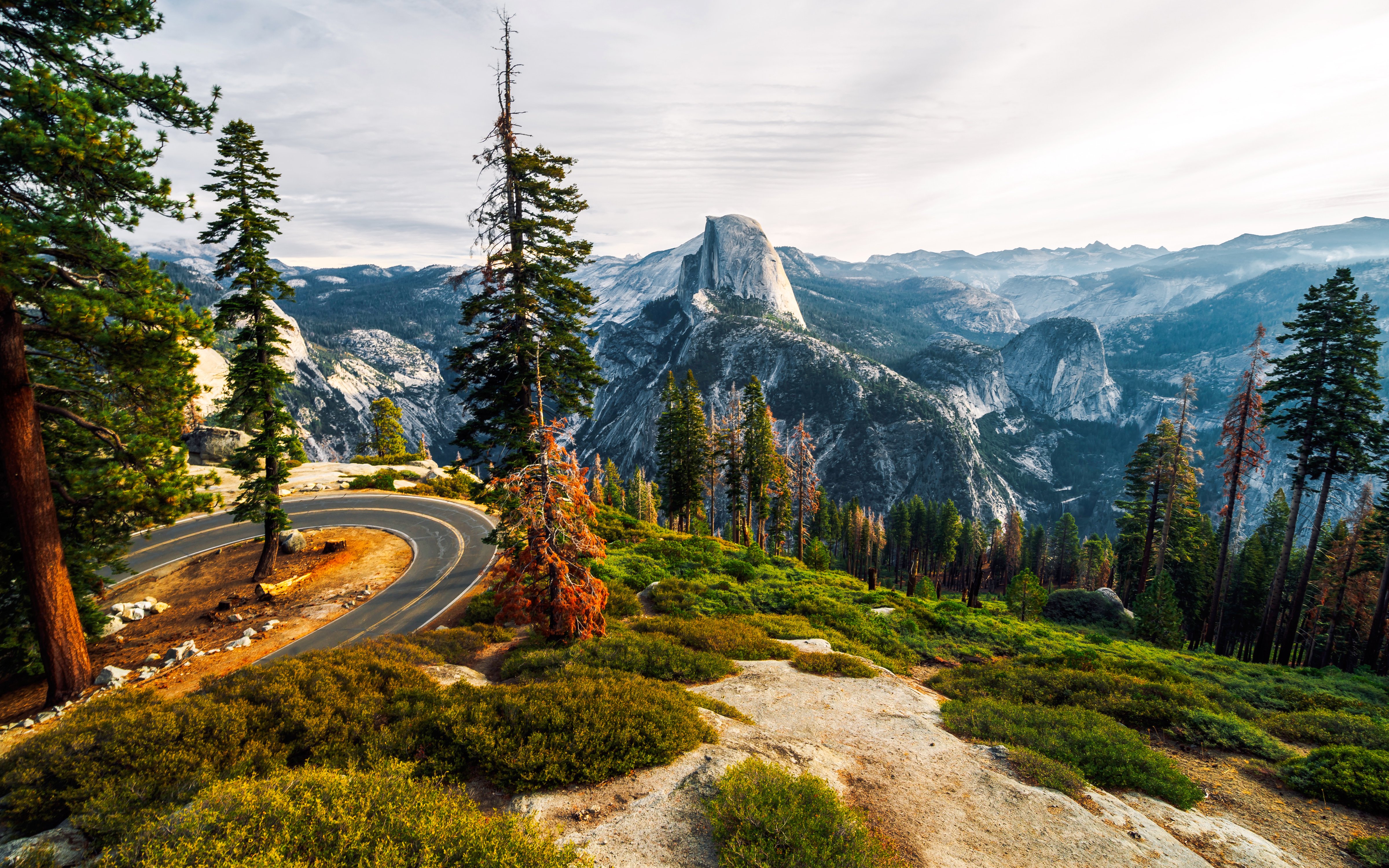 Winding road with view of Half Dome from Glacier Point, Yosemite National Park.