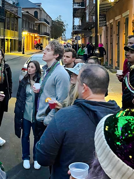 Group listening to a guide during New Orleans Haunted Ghost, Voodoo & Vampire Tour.