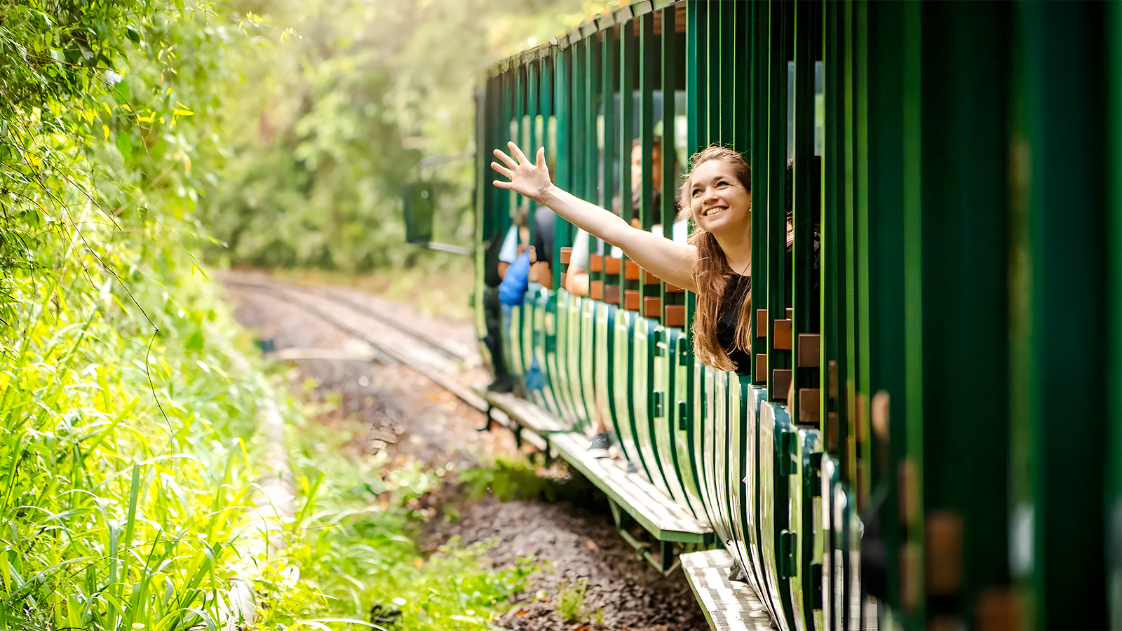 Train ride through lush greenery at Iguazu Falls, Argentina.