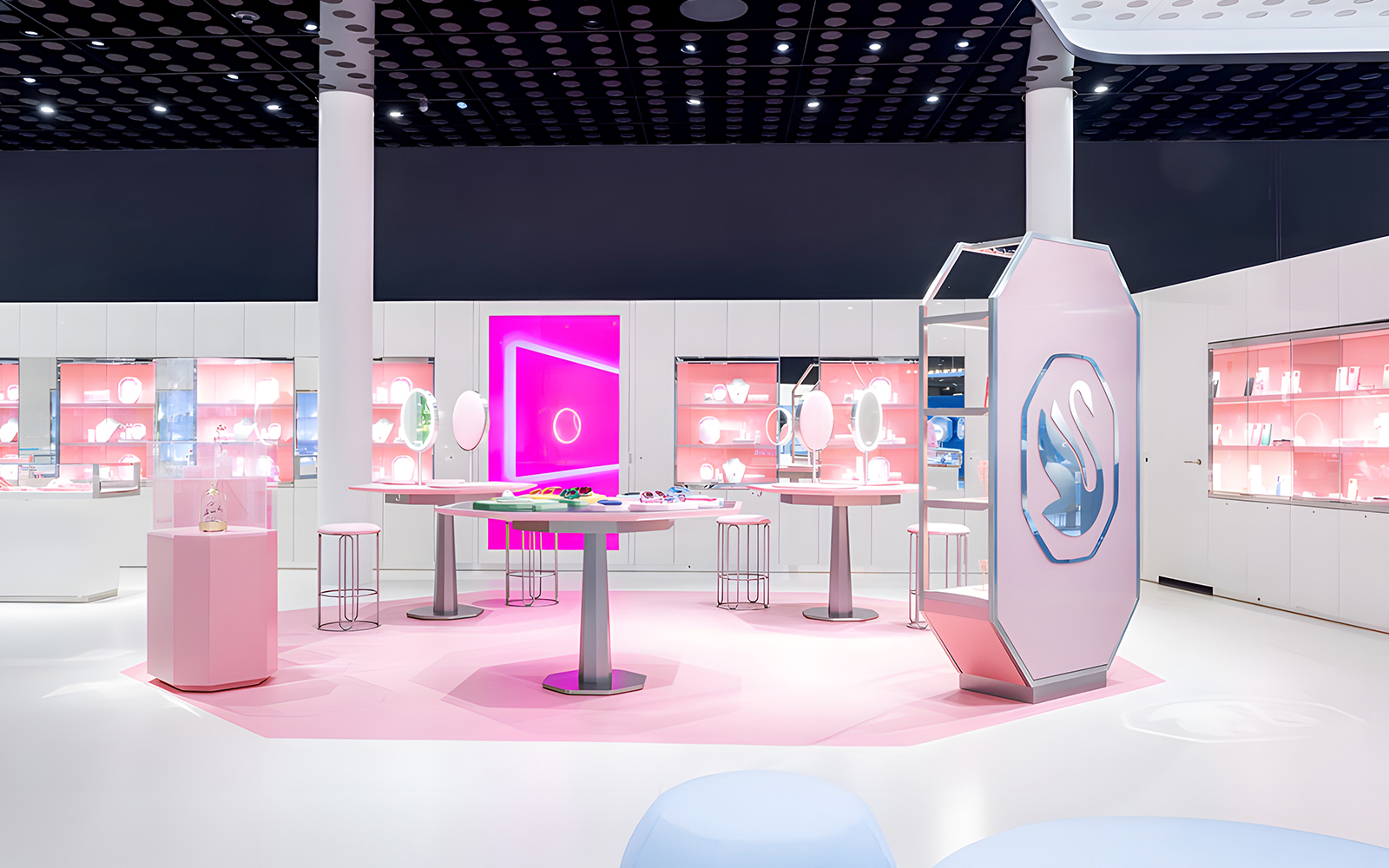 Swarovski Crystal Worlds exhibition room with pink displays and crystal exhibits.
