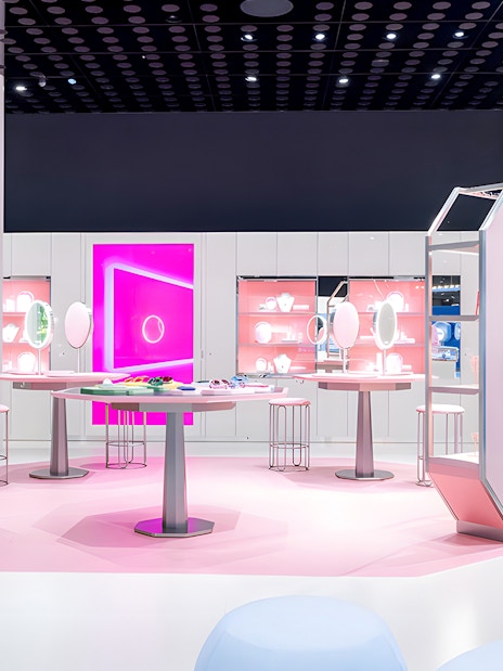 Swarovski Crystal Worlds exhibition room with pink displays and crystal exhibits.