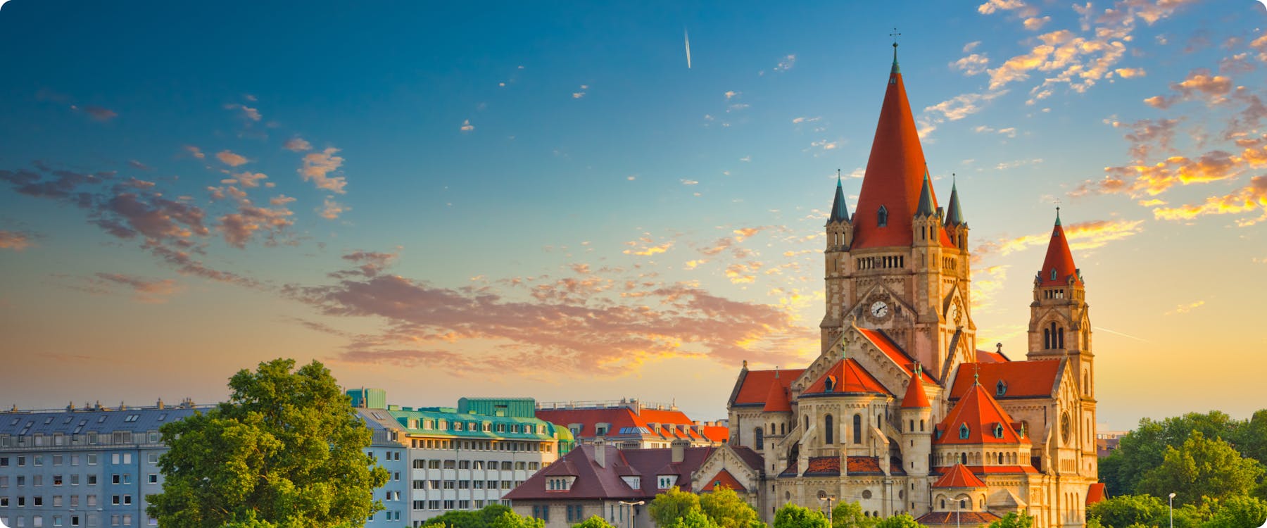 St. Francis of Assisi Church in Vienna at sunset with a colorful sky.