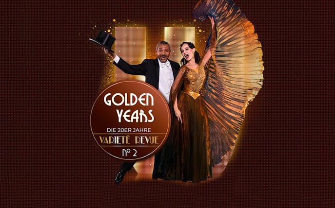 Performers in 1920s attire for Golden Years Varieté Revue No 2, holding a top hat and fan.