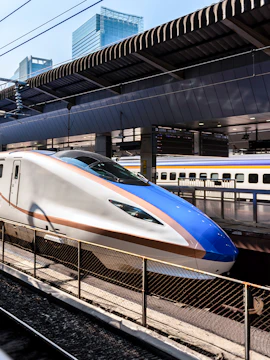 High-speed Shinkansen train at a Tokyo station, part of the JR Whole Japan Pass experience.