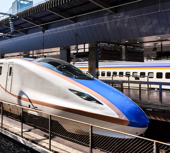 High-speed Shinkansen train at a Tokyo station, part of the JR Whole Japan Pass experience.
