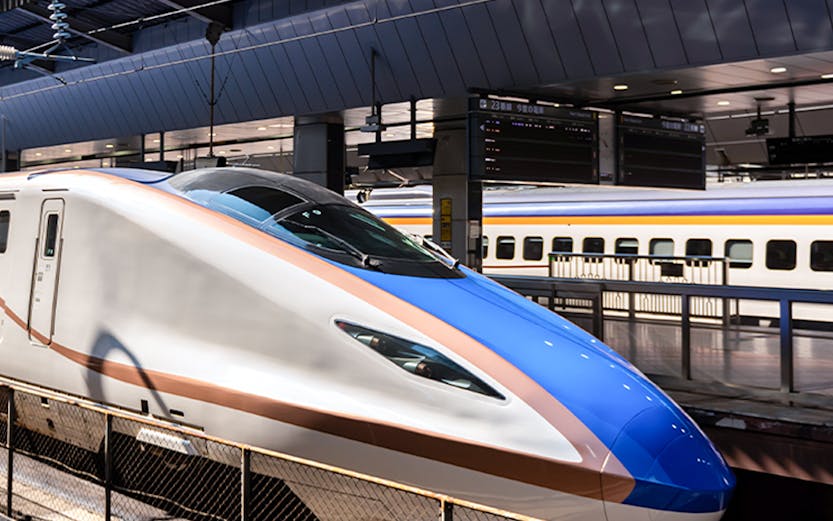 High-speed Shinkansen train at a Tokyo station, part of the JR Whole Japan Pass experience.