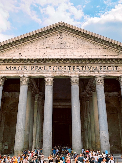 Pantheon facade with columns and crowd, Rome.