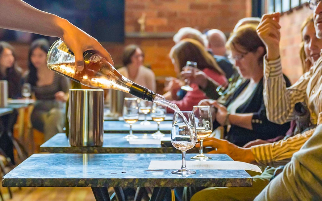 Wine being poured during a tasting session on the Yarra Valley Full Day Grazing Tour.