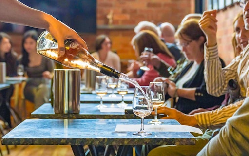 Wine being poured during a tasting session on the Yarra Valley Full Day Grazing Tour.