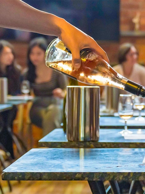 Wine being poured during a tasting session on the Yarra Valley Full Day Grazing Tour.