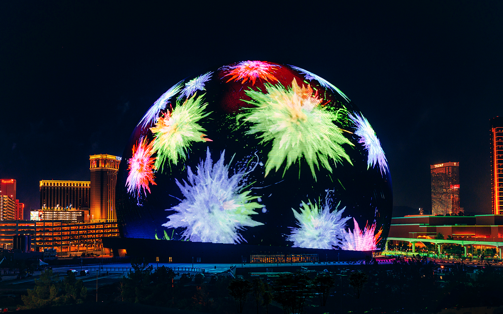Exterior of illuminated Sphere in Las Vegas with colorful light display.