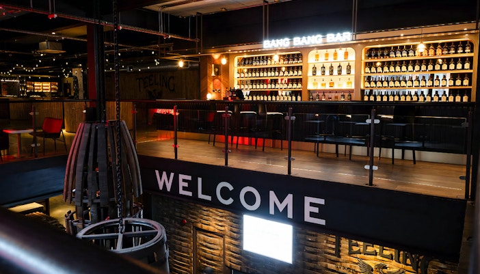 Bar area at Teeling Distillery with bottles displayed on shelves, Dublin, Ireland.