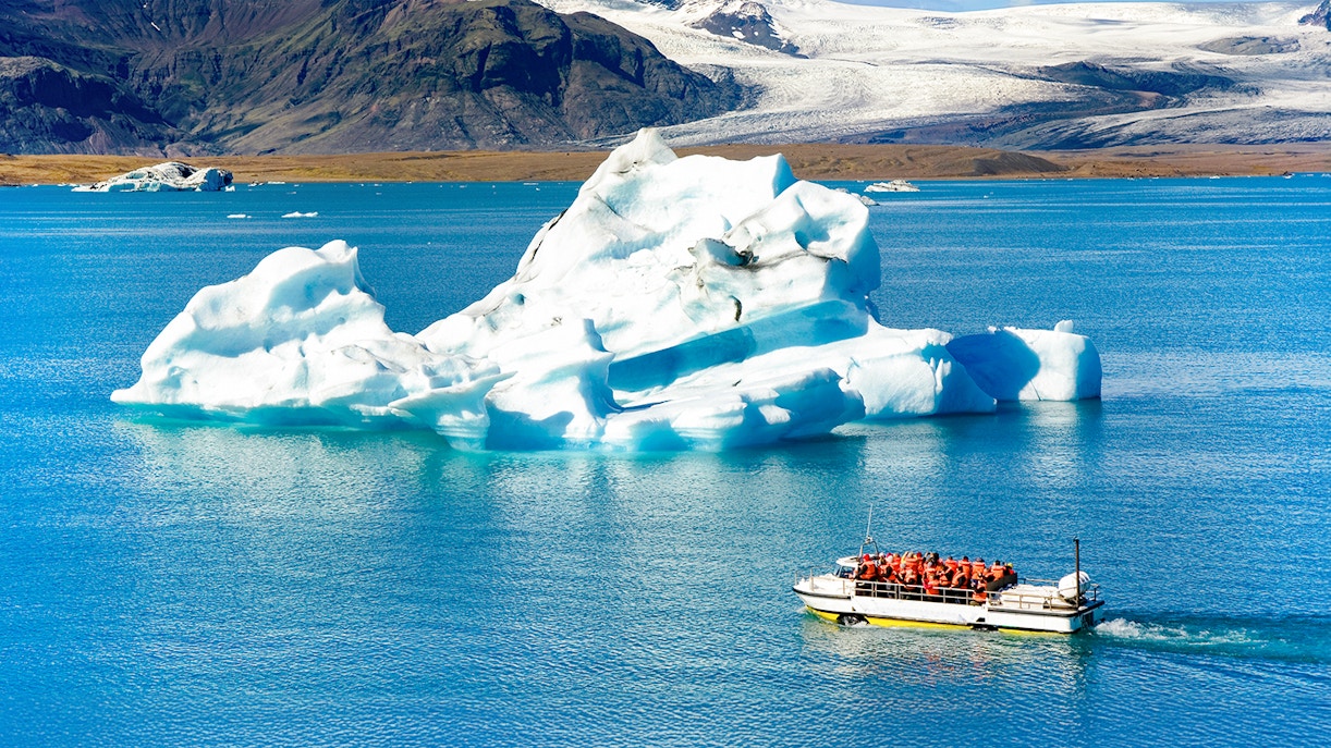 Boat ride near iceberg on Jökulsárlón glacial lake, Iceland.