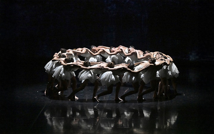 Dancers in a circle formation during Ballet Preljocaj's Swan Lake performance.