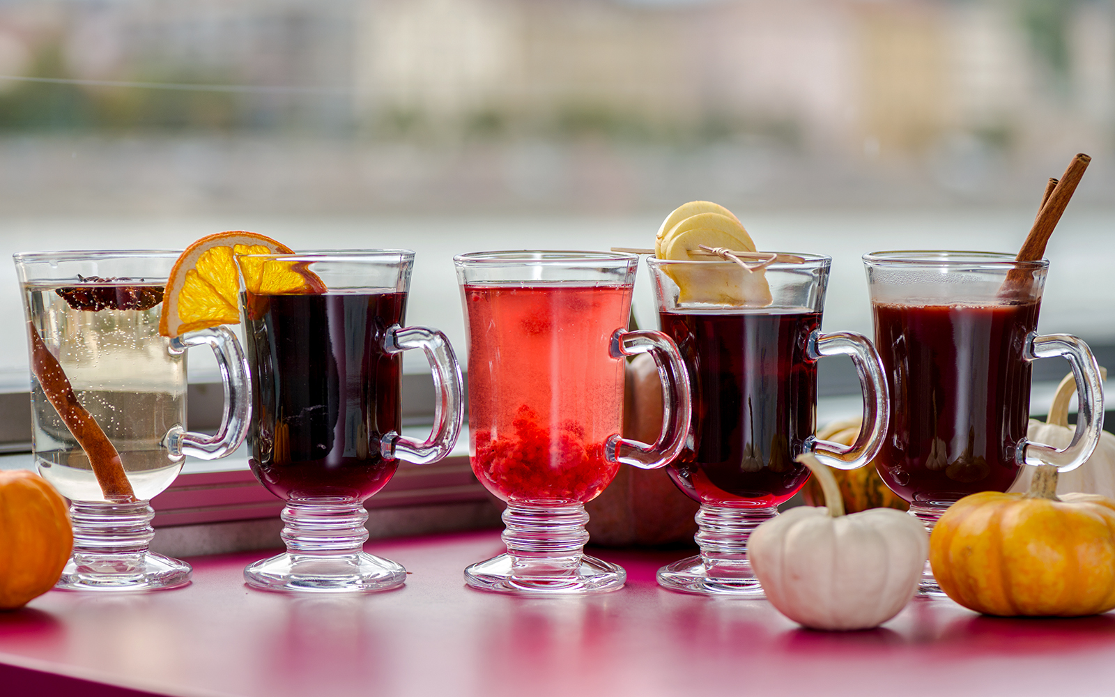 Glasses of mulled wine with spices on a Danube River nighttime sightseeing cruise.
