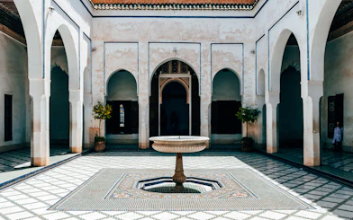 Bahia Palace courtyard with central fountain in Marrakech.