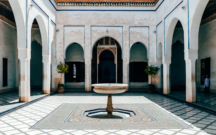 Bahia Palace courtyard with central fountain in Marrakech.