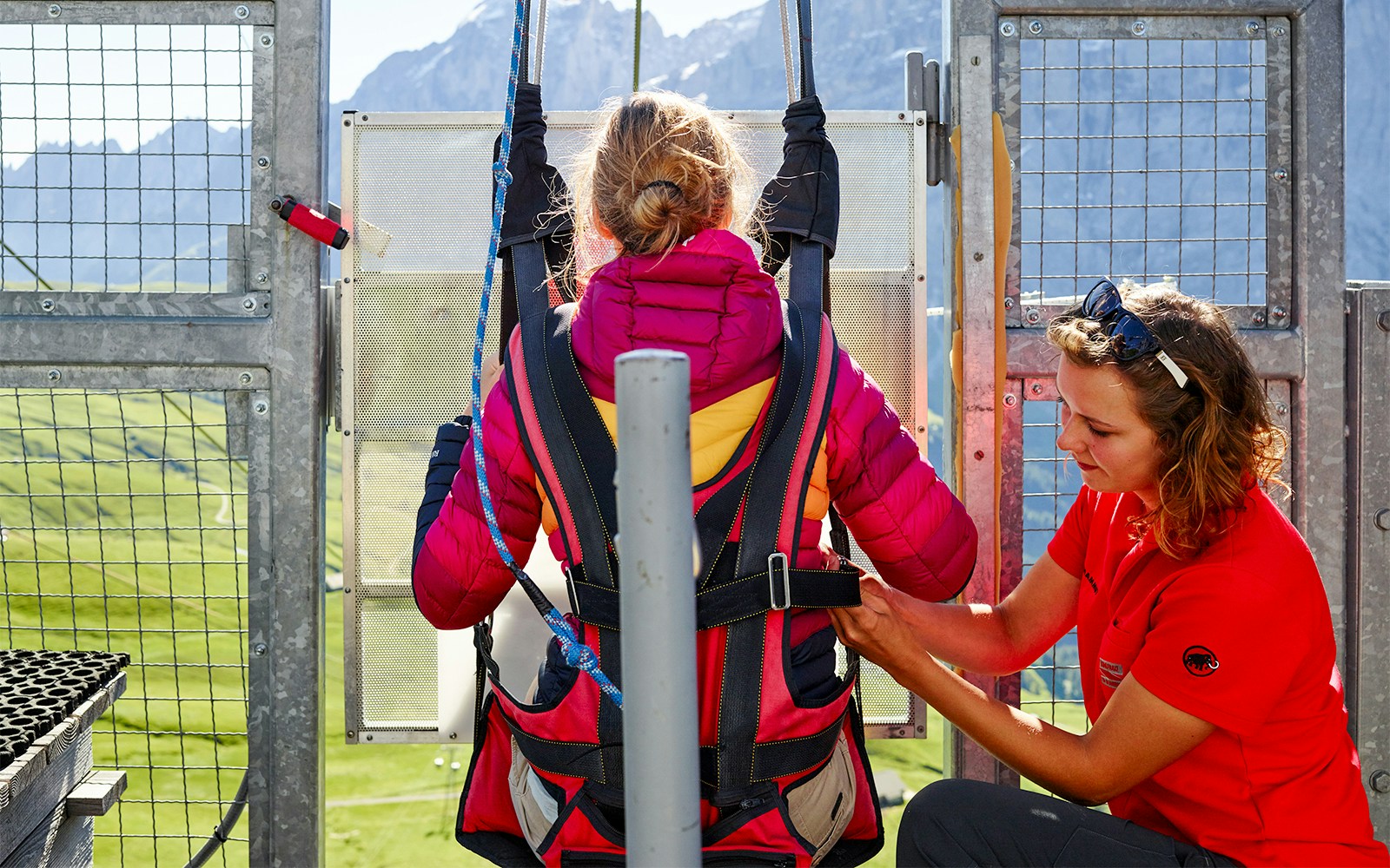 Tourists enjoying the First Glider ride over Grindelwald's scenic landscape.