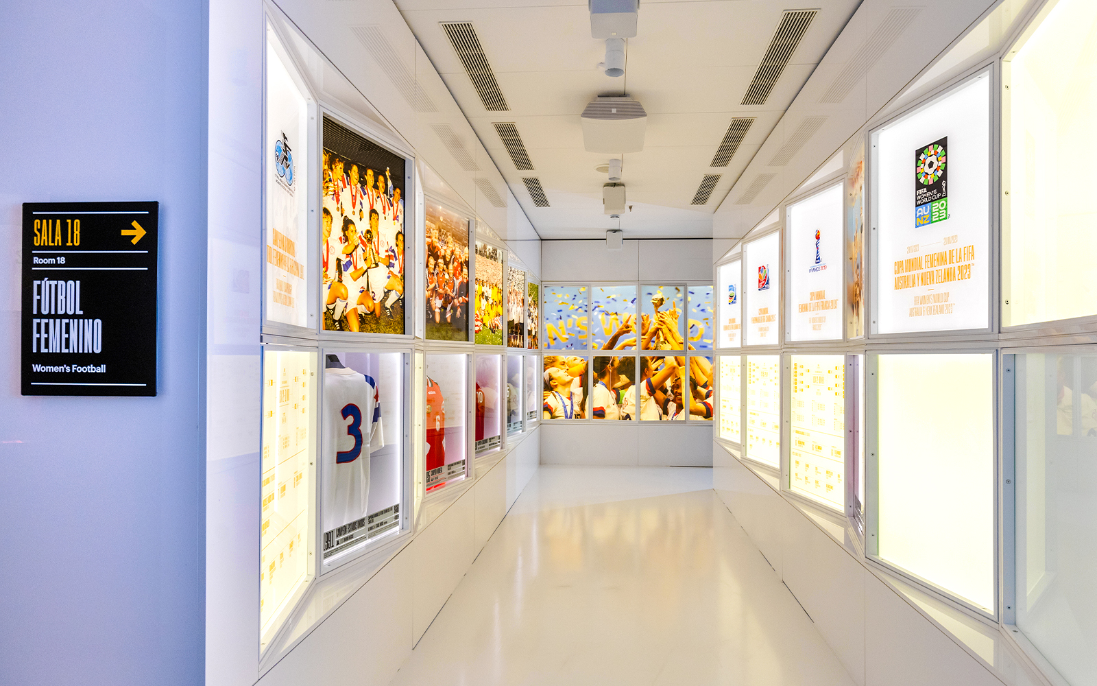 Football memorabilia display at Legends: The Home of Football Museum, featuring iconic jerseys and historic trophies.