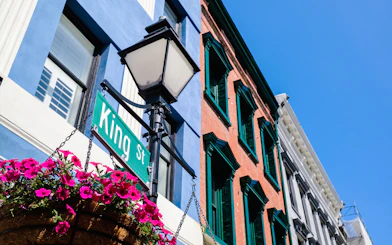 King Street sign and historic buildings in Charleston's French Quarter.