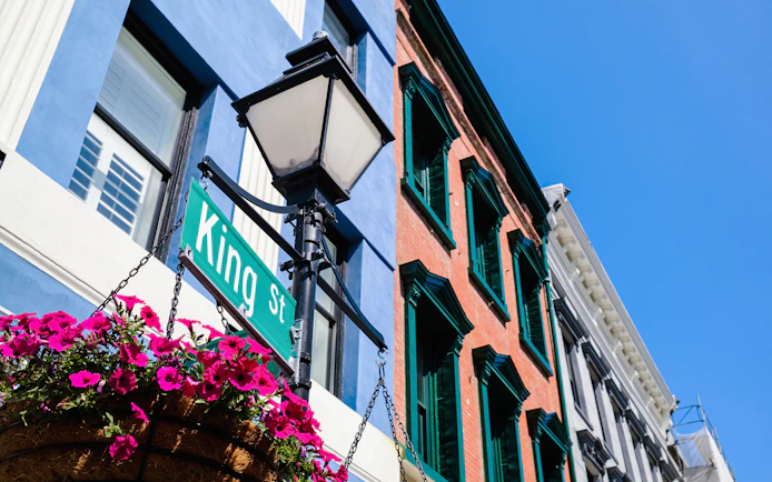 King Street sign and historic buildings in Charleston's French Quarter.