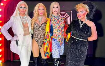 Drag queens posing on stage at a show in Hungary.