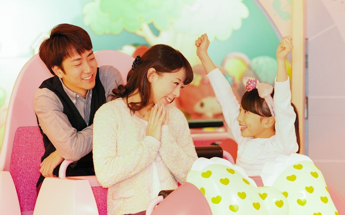Family enjoying a ride at Sanrio Puroland, Tokyo.