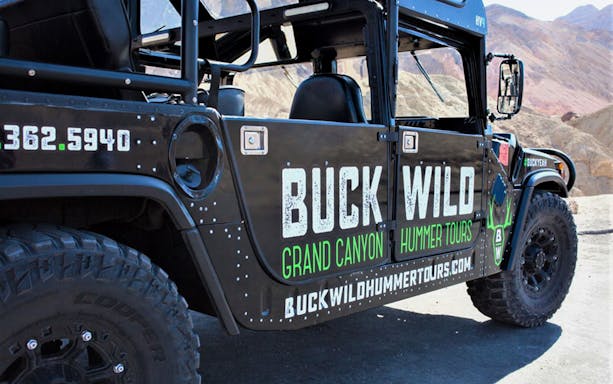 Hummer vehicle for Grand Canyon tour with Buck Wild branding.
