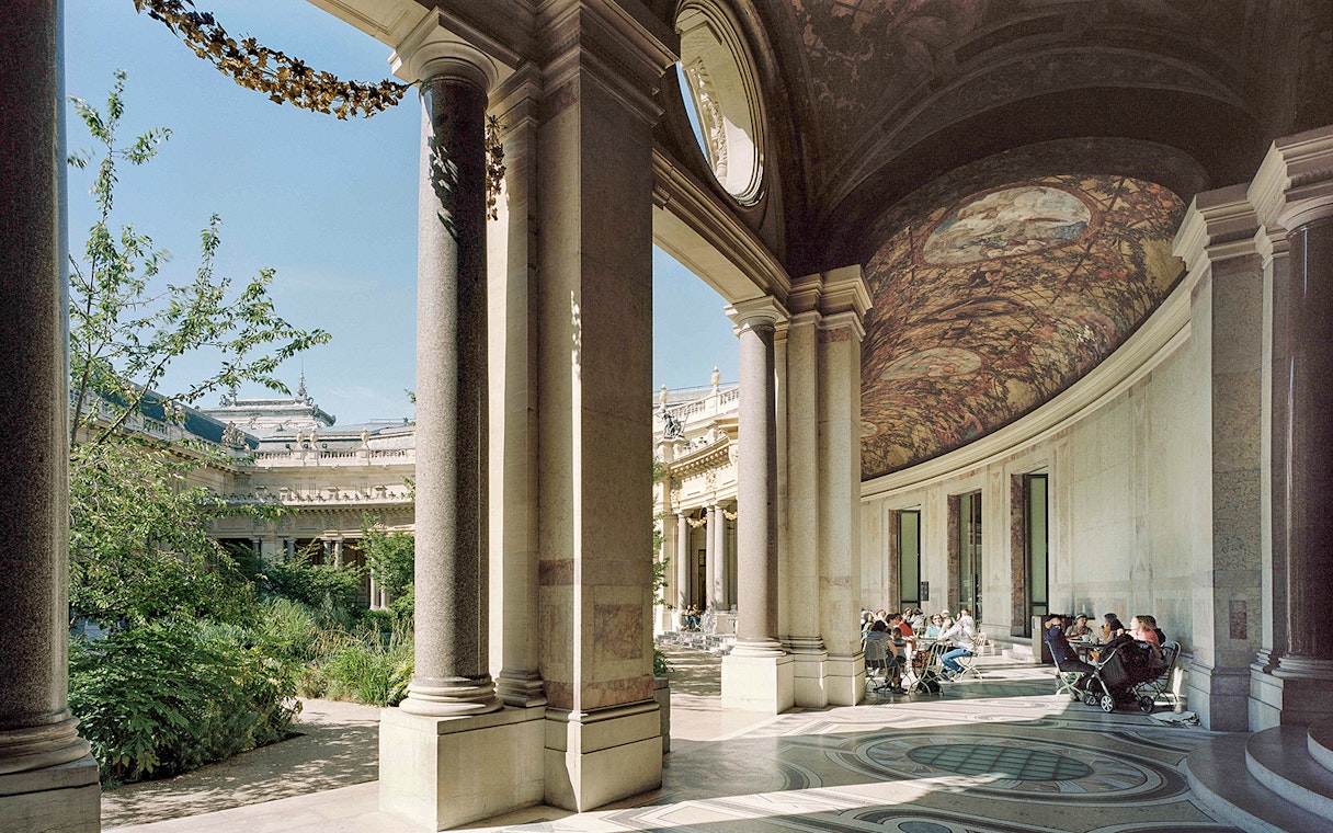 Petit Palais interior with visitors seated under ornate ceiling, Paris, Bruno Liljefors exhibition.