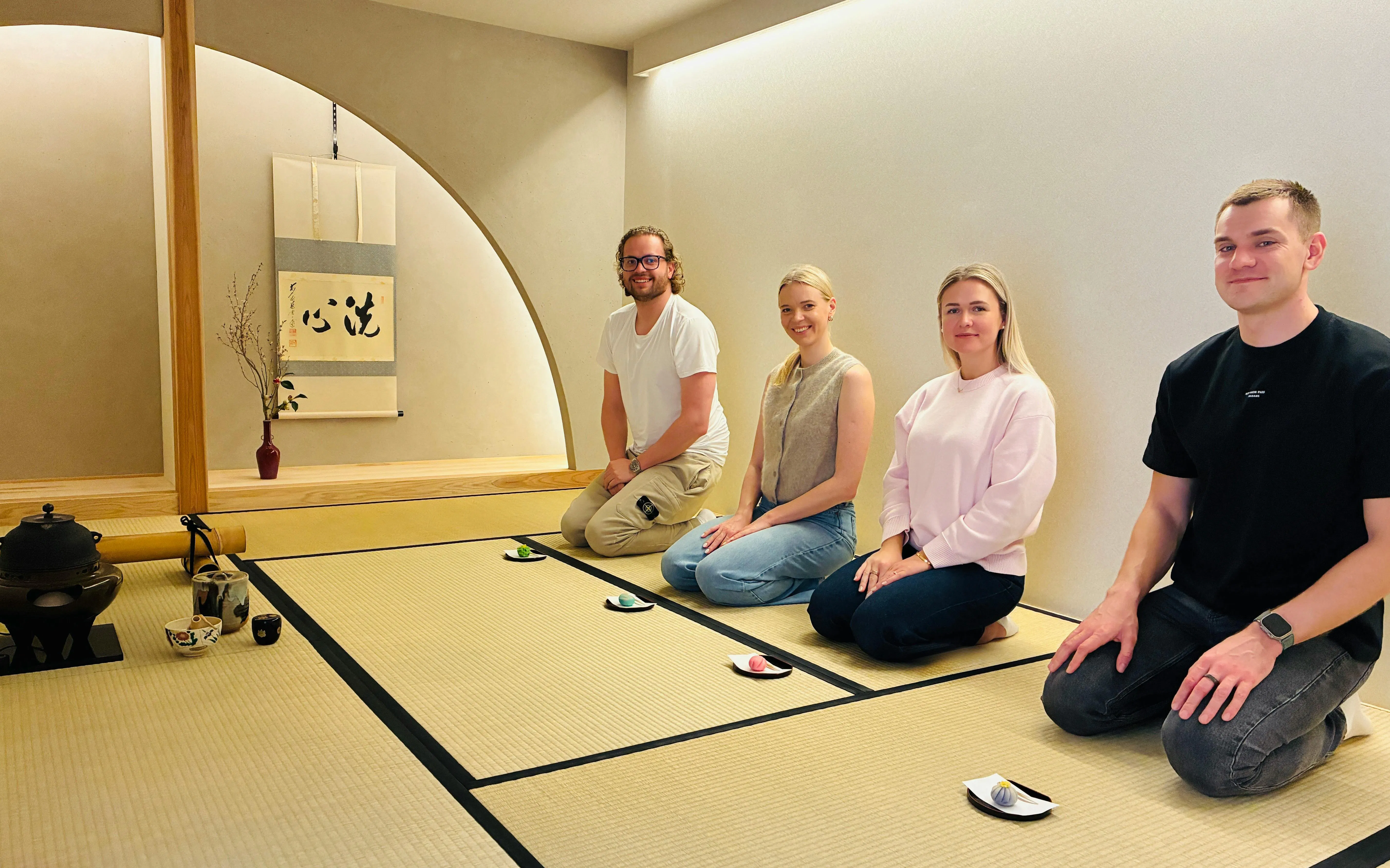Tourists participating in a traditional tea ceremony in Kyoto, Japan.
