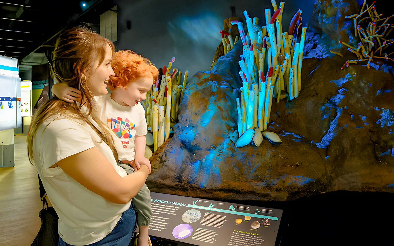 Guests viewing a model at 'Life at the Limits' exhibit, American Museum of Natural History.
