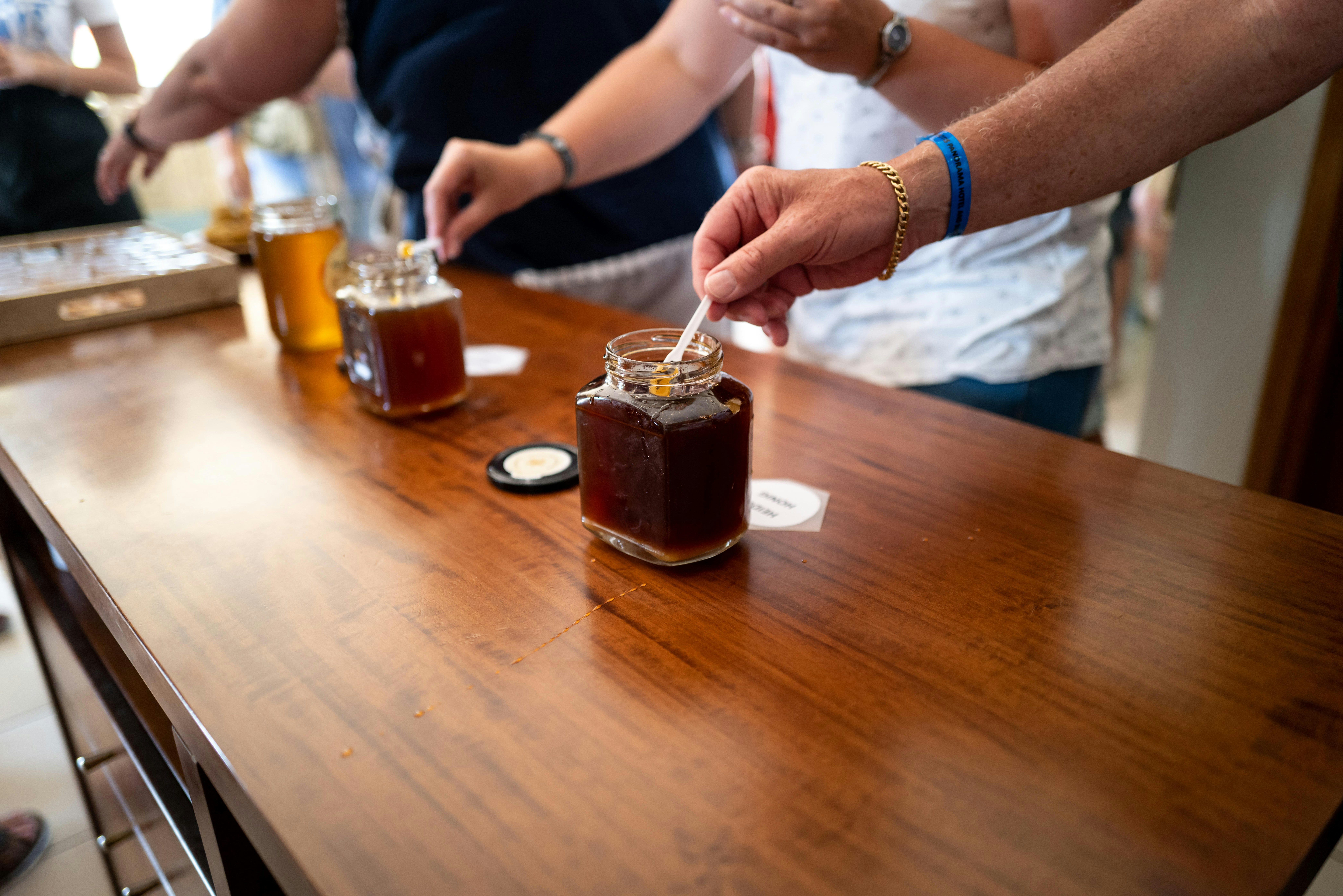people tasting honey