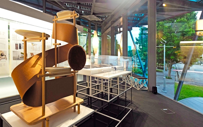 Exhibit inside Red Dot Design Museum Singapore with modern art display.