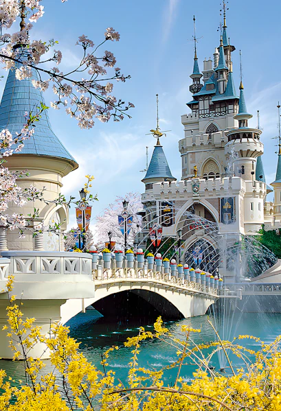 Lotte World castle with bridge and cherry blossoms in Seoul, South Korea.
