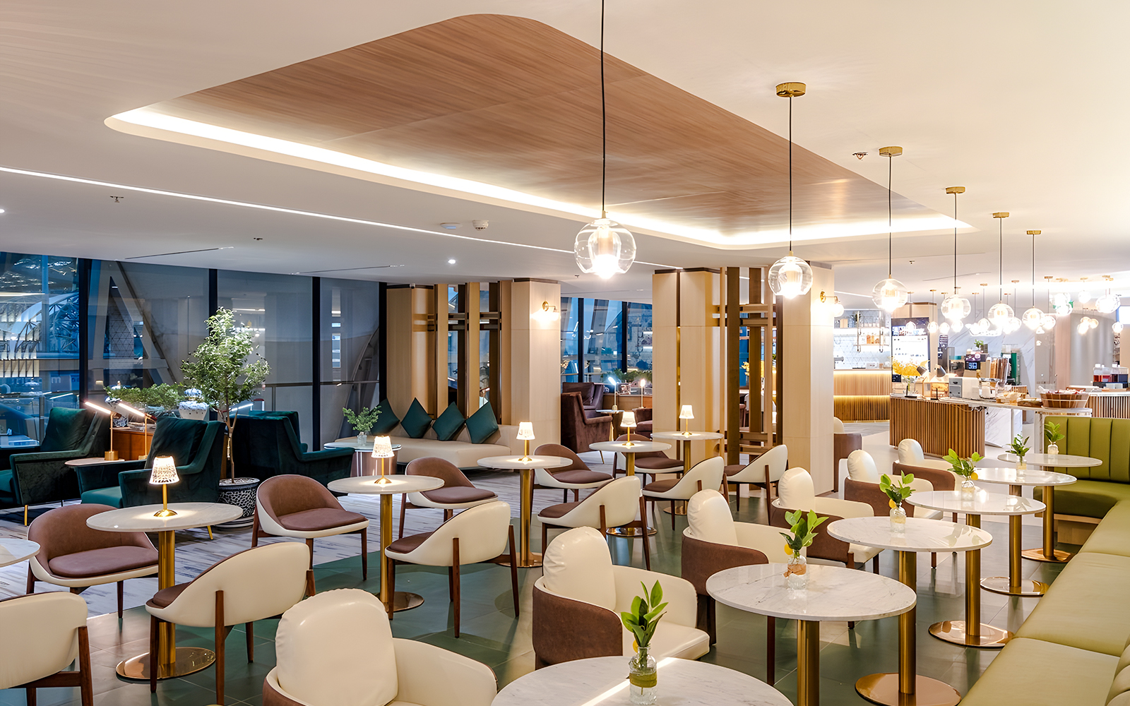 Coral Cosmo Lounge seating area with tables and chairs, Concourse C, Bangkok airport, Thailand.