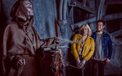 Visitors react to a costumed actor at the York Dungeon's Fear the Vikings experience.
