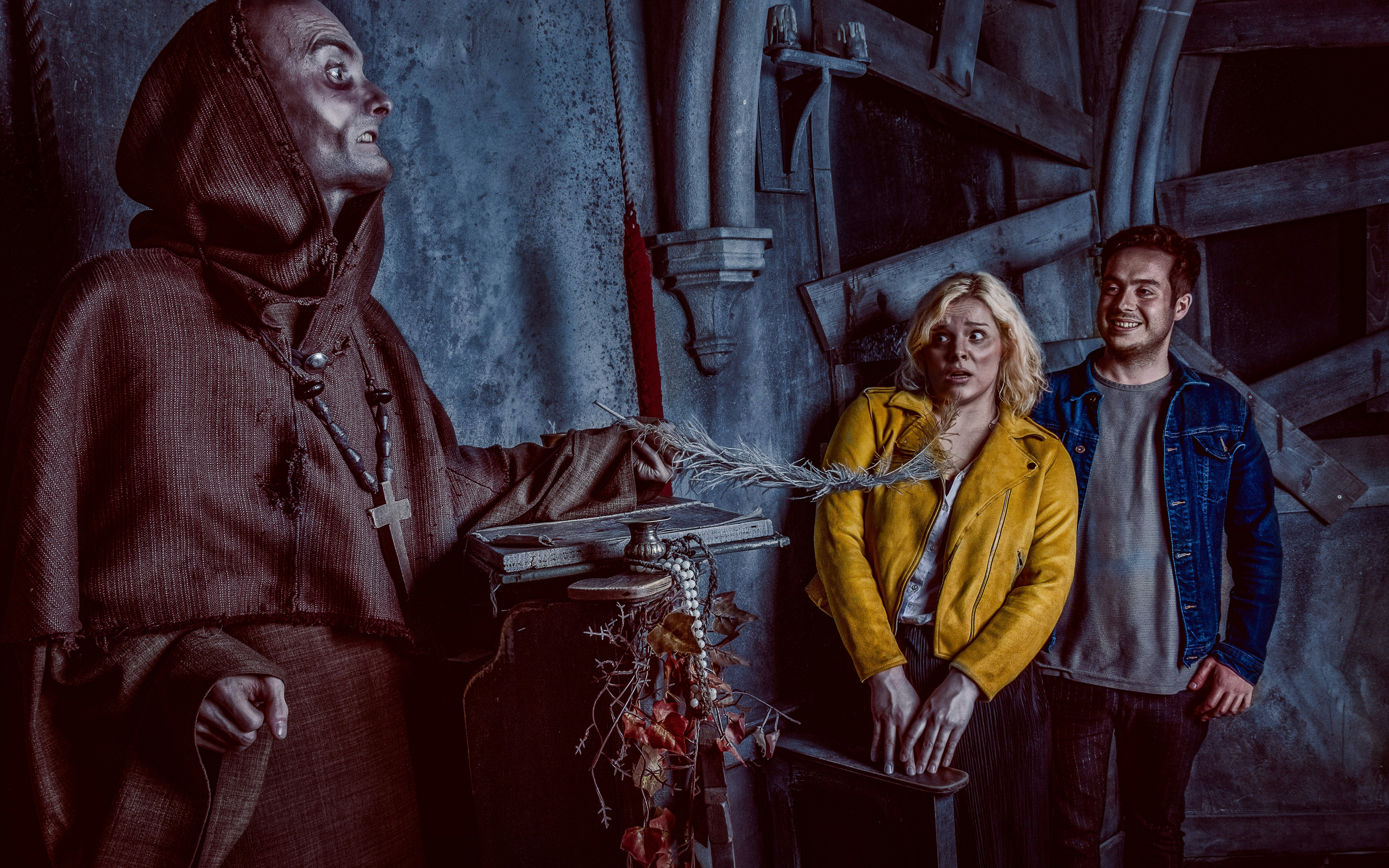 Visitors react to a costumed actor at the York Dungeon's Fear the Vikings experience.
