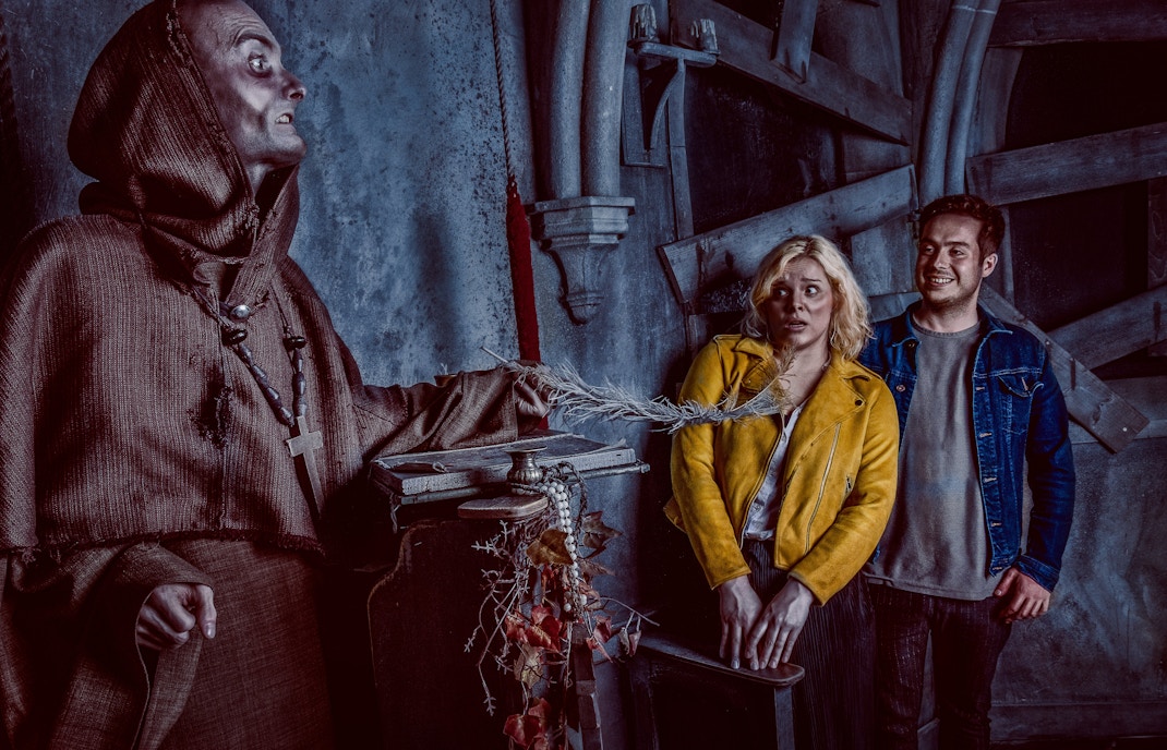 Visitors react to a costumed actor at the York Dungeon's Fear the Vikings experience.