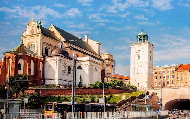 Warsaw church and bell tower on a sunny day during a private walking tour.