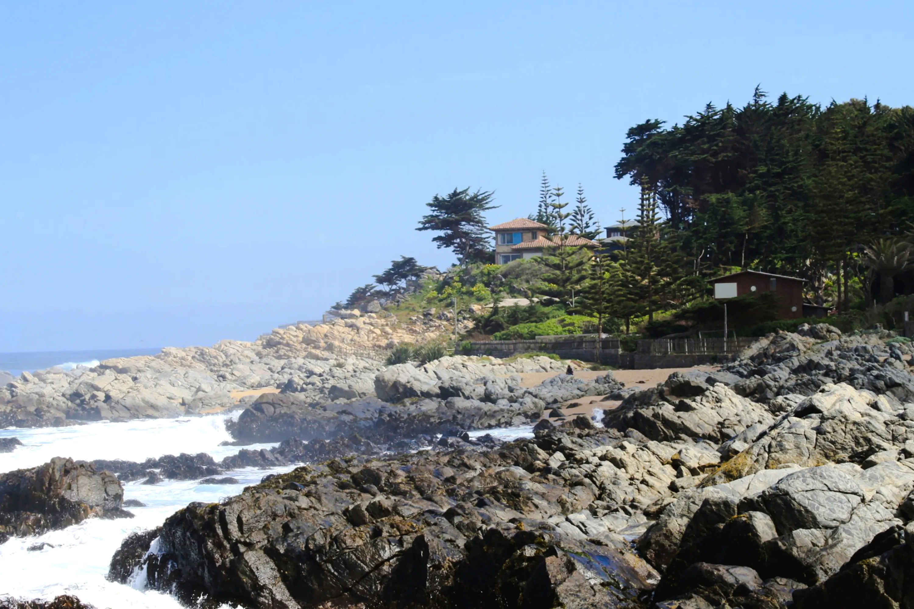 Rocky coastline with waves near Pablo Neruda's Museum, Isla Negra, Santiago.