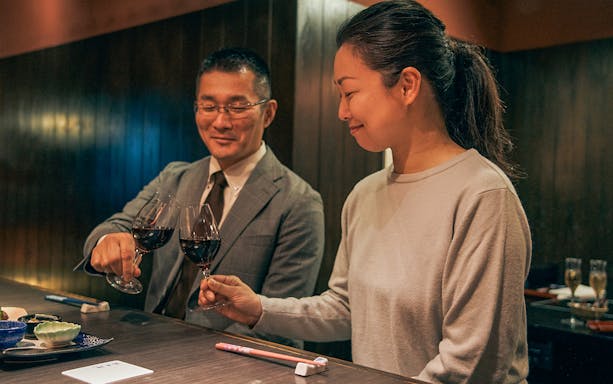 Toasting with wine at Ginza Hanadaikon during a 5/6-course meal experience.
