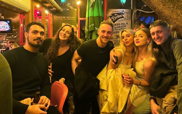 Group enjoying a night out on a pub and bar tour.