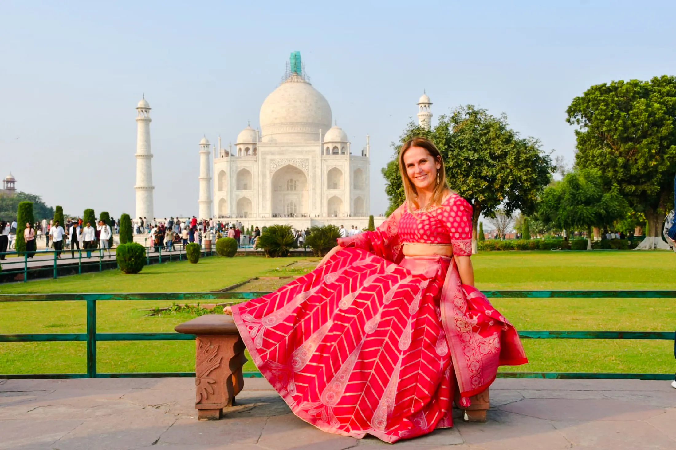 Tourist in traditional attire at Taj Mahal, Agra, with fast-track entry.