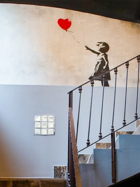 Banksy artwork of girl with balloon at Banksy Museum, Barcelona.