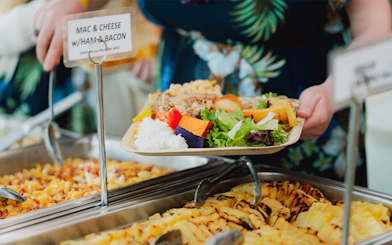 Plate of traditional Hawaiian food at Mauka Warriors Luau buffet.