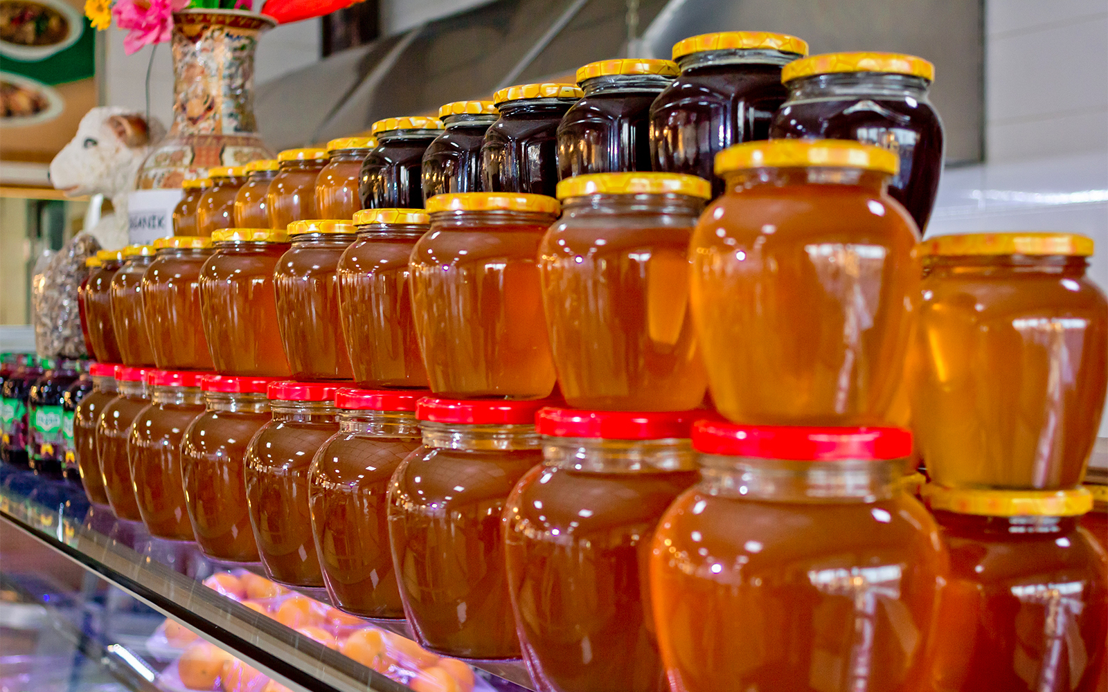 Honey and jam jars stacked up in shop near Castel del Monte