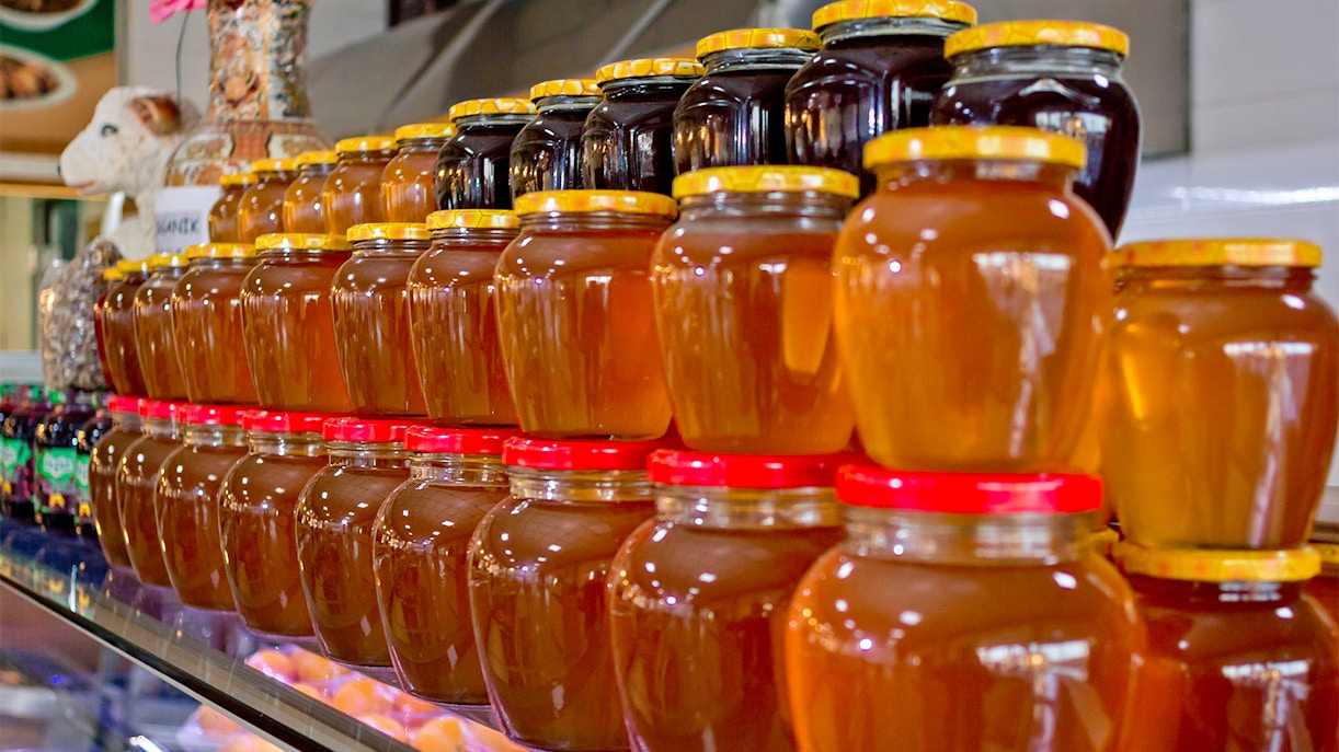 Honey and jam jars stacked up in shop near Castel del Monte